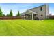Expansive backyard with privacy fence, covered patio, pergola, and lush lawn at 2622 Perthshire Ln, Fuquay Varina, NC 27526