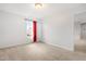Bedroom with neutral walls and carpet, a window with red curtains, and a closet at 2622 Perthshire Ln, Fuquay Varina, NC 27526