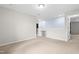 Bonus room with neutral carpet, light-colored walls, and a partial wall with a gate at 2622 Perthshire Ln, Fuquay Varina, NC 27526