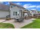 The backyard patio includes stone pavers, a dining set, and easy access to the covered patio from the house at 2721 Dahlgreen Rd, Raleigh, NC 27615