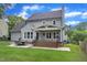 Spacious backyard with a covered patio and well-kept lawn offers an ideal space for outdoor activities and relaxation at 2721 Dahlgreen Rd, Raleigh, NC 27615