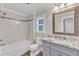 Bathroom featuring granite countertops, custom cabinets, a bath and a shower at 2721 Dahlgreen Rd, Raleigh, NC 27615