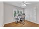 Bedroom featuring hardwood flooring, a ceiling fan, and double door closet at 2721 Dahlgreen Rd, Raleigh, NC 27615