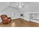 Bonus room featuring hardwood flooring and a built-in entertainment center at 2721 Dahlgreen Rd, Raleigh, NC 27615