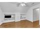 Bonus room featuring hardwood flooring and a built-in entertainment center at 2721 Dahlgreen Rd, Raleigh, NC 27615