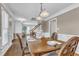 Spacious dining room featuring hardwood floors, decorative lighting, and an open floor plan leading to the staircase at 2721 Dahlgreen Rd, Raleigh, NC 27615