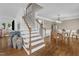 Elegant dining room with hardwood floors, staircase, and comfortable seating arrangement at 2721 Dahlgreen Rd, Raleigh, NC 27615