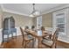Formal dining room with hardwood floors, decorative lighting, and large windows that let in natural light at 2721 Dahlgreen Rd, Raleigh, NC 27615