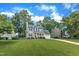 Attractive two-story home with a well-maintained lawn in a lush, green neighborhood at 2721 Dahlgreen Rd, Raleigh, NC 27615