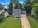 Charming home with a well-maintained lawn, inviting front porch, and attached garage offers classic curb appeal at 2721 Dahlgreen Rd, Raleigh, NC 27615