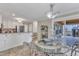 Open kitchen and dining area featuring a glass table and stainless steel appliances at 2721 Dahlgreen Rd, Raleigh, NC 27615