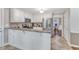 Spacious kitchen with granite counters and stainless appliances open to dining area; perfect for entertaining at 2721 Dahlgreen Rd, Raleigh, NC 27615