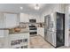 Well-equipped kitchen with granite countertops, stainless steel appliances, and ample cabinet space at 2721 Dahlgreen Rd, Raleigh, NC 27615