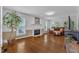 Inviting living room featuring a fireplace, hardwood floors, and natural light at 2721 Dahlgreen Rd, Raleigh, NC 27615