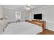 Main bedroom with neutral paint, wood floors, a ceiling fan and attached bathroom at 2721 Dahlgreen Rd, Raleigh, NC 27615