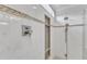 Shower with marble tiling, built-in toiletry shelf, and dual shower heads at 2721 Dahlgreen Rd, Raleigh, NC 27615