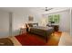 Cozy bedroom with a ceiling fan, work station, and neutral decor at 2721 Silver Stirrup Ln, Apex, NC 27502