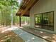 Exterior showing the side of the house with a covered porch and large windows at 2721 Silver Stirrup Ln, Apex, NC 27502