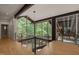 Bright foyer with glass railing and scenic wooded views through expansive windows at 2721 Silver Stirrup Ln, Apex, NC 27502