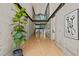 Bright foyer with concrete walls, wooden floors, modern art and steel accents, creating a modern aesthetic at 2721 Silver Stirrup Ln, Apex, NC 27502