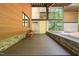 Modern home exterior featuring a wooden porch and a vibrant yellow door at 2721 Silver Stirrup Ln, Apex, NC 27502
