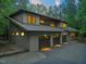 Home exterior with a three-car garage and well-manicured landscaping at 2721 Silver Stirrup Ln, Apex, NC 27502