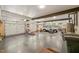 A spacious garage with multiple doors, a truck, tools and ample storage space at 2721 Silver Stirrup Ln, Apex, NC 27502