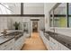 Modern kitchen with stainless steel appliances, gas range island, sleek cabinets, and an open layout at 2721 Silver Stirrup Ln, Apex, NC 27502