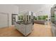 Open-concept kitchen with gas range island, stainless steel appliances, and seamless flow to the dining and living areas at 2721 Silver Stirrup Ln, Apex, NC 27502