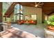 Covered patio with a seating area and views of the surrounding woods at 2721 Silver Stirrup Ln, Apex, NC 27502