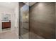 Modern glass enclosed shower with contemporary tile and views of the ensuite bathroom at 2721 Silver Stirrup Ln, Apex, NC 27502
