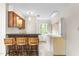 Bar area features an eating counter with stools and a window that provides natural light at 3123 Amherst Ave, Burlington, NC 27215