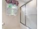 Bathroom features a large shower with glass doors and bright natural light at 3123 Amherst Ave, Burlington, NC 27215