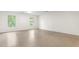 Large bedroom space with neutral flooring and natural light from large windows at 3123 Amherst Ave, Burlington, NC 27215