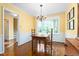 Charming dining area with hardwood floors, natural light, and yellow walls at 3123 Amherst Ave, Burlington, NC 27215