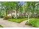 A well-maintained home with a brick walkway and verdant landscaping at 3123 Amherst Ave, Burlington, NC 27215