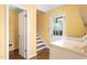 Practical laundry area features a white washer and dryer, cabinets, and access to the backyard at 3123 Amherst Ave, Burlington, NC 27215