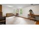 Bright living room features large windows, carpet, and hardwood floors at 3123 Amherst Ave, Burlington, NC 27215