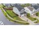 Beautiful home featuring a manicured lawn, a paved driveway, and a classic two-car garage at 348 Golf Vista Trl, Holly Springs, NC 27540
