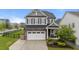 Attractive home with a two-car garage, well-kept landscaping, and inviting curb appeal at 348 Golf Vista Trl, Holly Springs, NC 27540