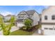 Well-maintained home featuring a two-car garage, manicured lawn, and classic architecture at 348 Golf Vista Trl, Holly Springs, NC 27540