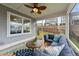 Relaxing screened porch with a comfortable seating area and view of the backyard at 348 Golf Vista Trl, Holly Springs, NC 27540