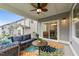 Inviting screened porch with cozy seating and outdoor living space at 348 Golf Vista Trl, Holly Springs, NC 27540