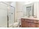 A bathroom with tiled stand up shower, toilet and single sink at 362 Warm Wind Dr, Clayton, NC 27527