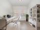 Bright office space featuring modern shelving and a sleek desk, ideal for working from home at 362 Warm Wind Dr, Clayton, NC 27527