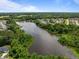 An aerial shot shows a picturesque lake bordered by lush greenery and neighborhood homes at 3625 Bailey Lake Dr, Fuquay Varina, NC 27526