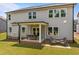 Expansive backyard featuring a covered patio with dining and lounge seating, ideal for outdoor living at 3625 Bailey Lake Dr, Fuquay Varina, NC 27526
