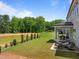 Spacious backyard features a pond and two patios with seating areas for entertaining at 3625 Bailey Lake Dr, Fuquay Varina, NC 27526