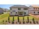 Spacious backyard showcasing a well-maintained lawn, a covered patio, and lush landscaping at 3625 Bailey Lake Dr, Fuquay Varina, NC 27526