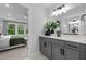 Well-lit bathroom with neutral cabinets, double vanity, and modern fixtures at 3625 Bailey Lake Dr, Fuquay Varina, NC 27526